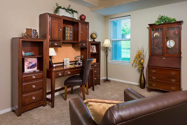 Cozy interior of a private room with desk and furnishings