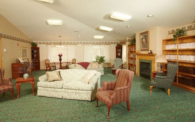 Cozy living room with seating and bookshelves