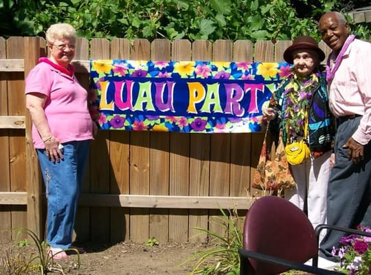 Residents enjoying a Luau party in the garden
