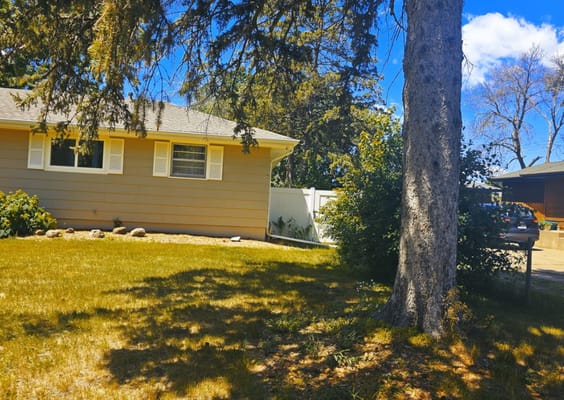 Exterior view of a nursing home surrounded by trees