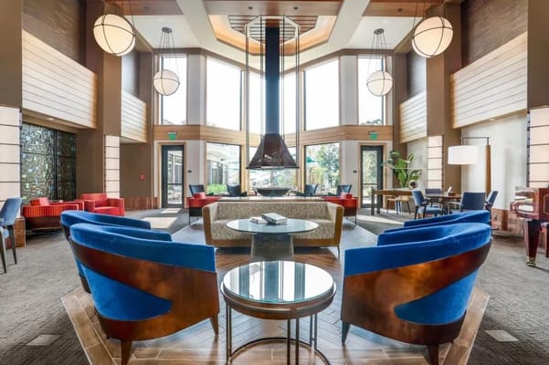 Brightly lit common area with modern decor and seating