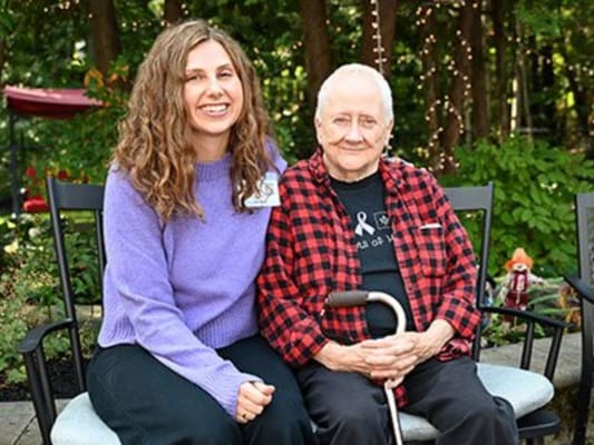 Resident and staff member enjoying the outdoors