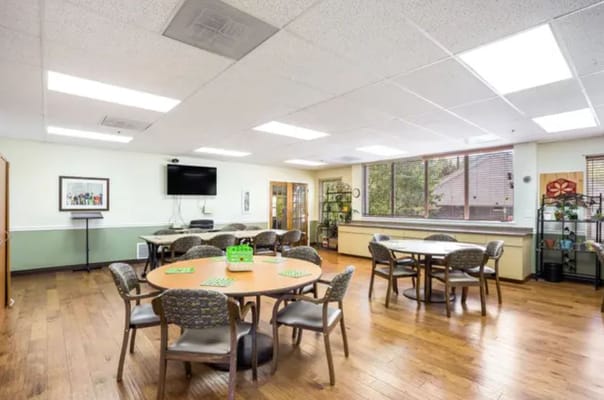 Bright common area with tables and chairs