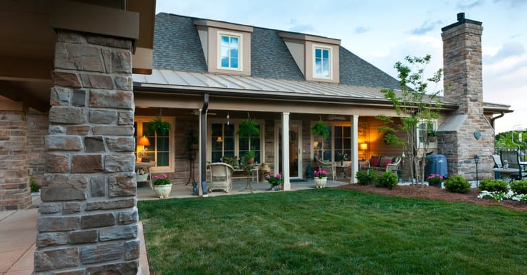 Exterior view of a senior living facility with a garden