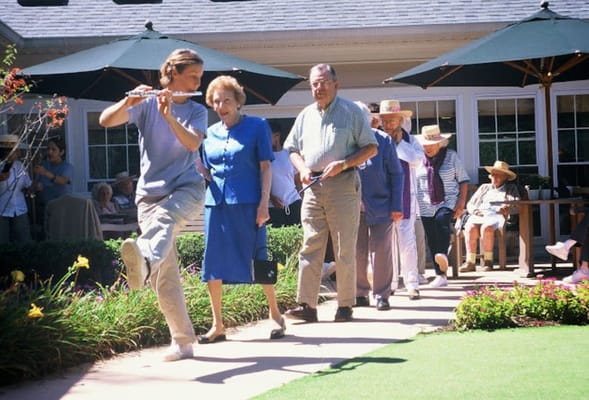 Residents enjoying a stroll outside in the garden