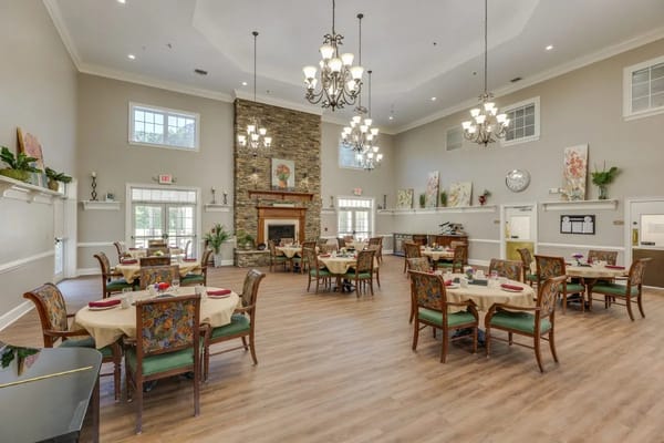 Spacious dining room with tables set for meals