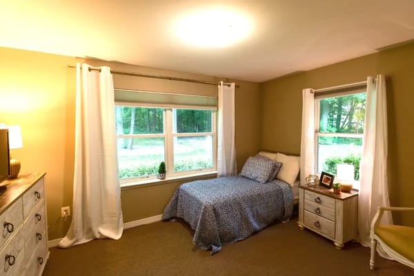 Cozy private bedroom in a senior living facility