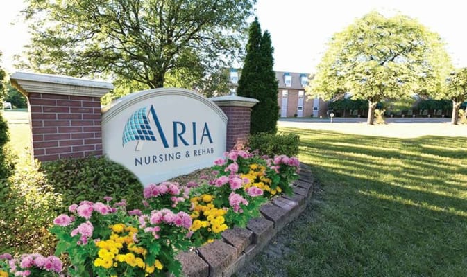 Facility sign with flowers in the garden