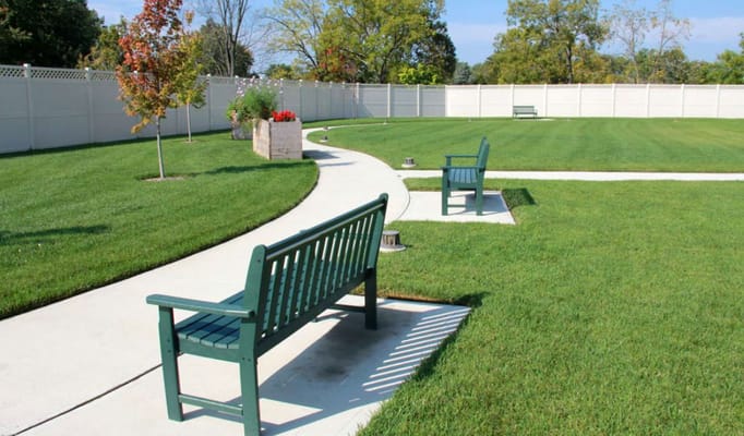 Well-maintained outdoor space with benches and walking paths