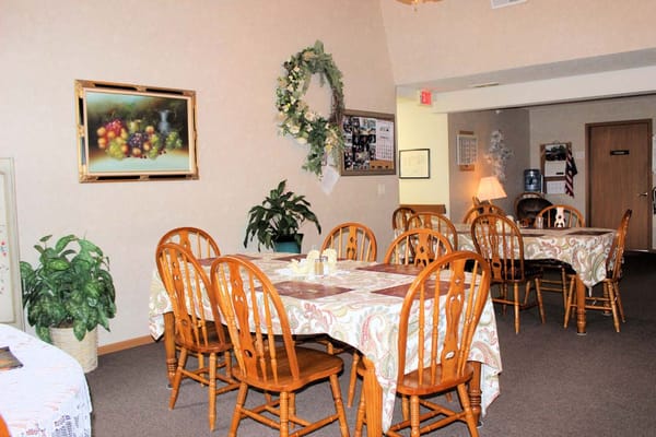 Dining area with wooden tables and chairs