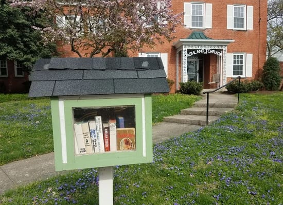 Little free library in front of a senior living facility