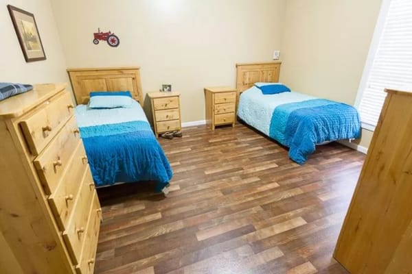 Bright interior of a resident room with two beds