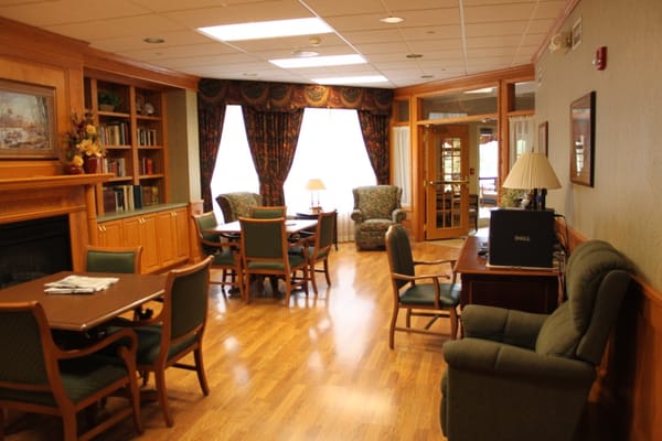 Cozy common area with seating and tables.