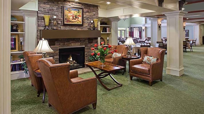 Comfortable common area with seating and fireplace