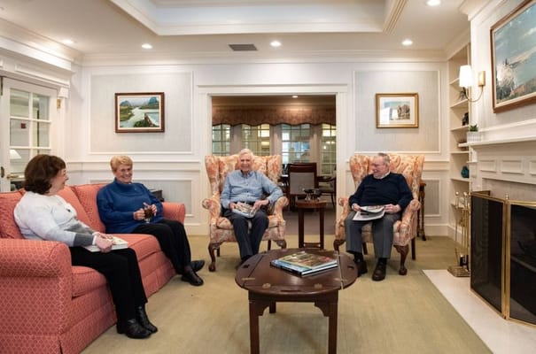 Residents enjoying conversation in a cozy common area
