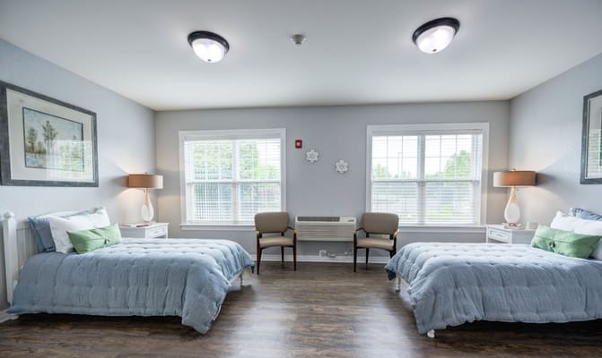 Bright interior of a shared resident room with two beds