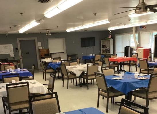 Interior dining area set with tables