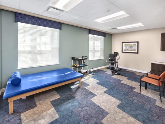Interior of a physical therapy room with exercise equipment
