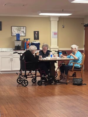 Residents enjoying a meal together in a dining area