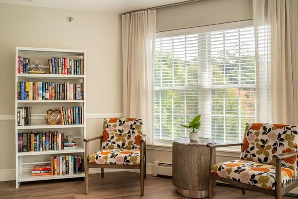 Cozy lounge area with bookshelves and seating
