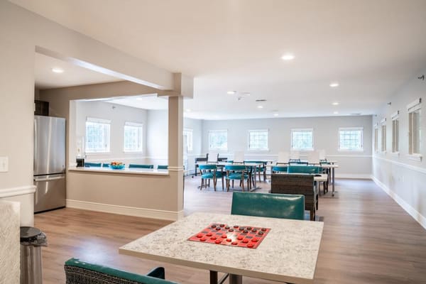 Bright common area with tables and chairs