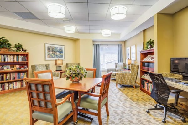 Cozy common area with seating and bookshelves