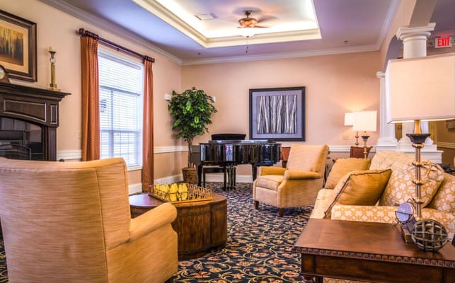 Cozy lounge area with comfortable seating and piano