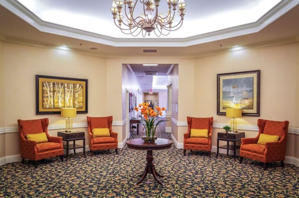 Cozy common area with seating and floral decor