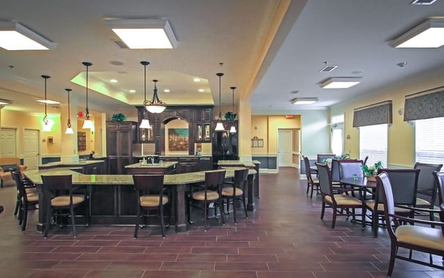 Bright communal dining area with kitchen space