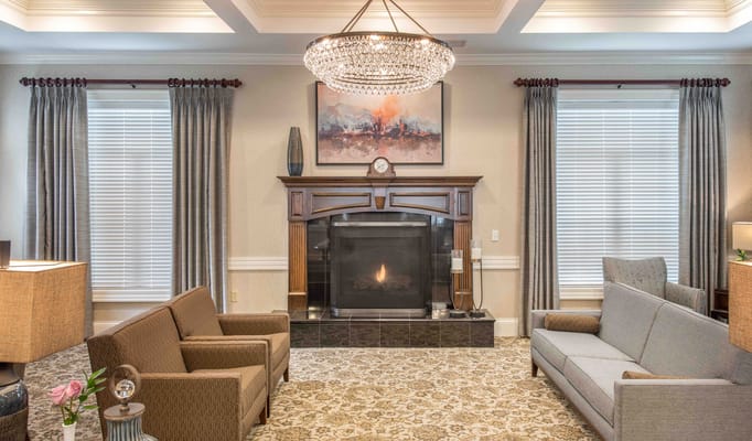 Cozy lobby area with seating and fireplace