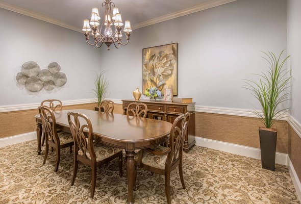 Elegant dining room with a large table and chandelier