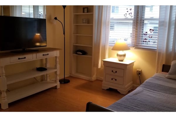 Cozy resident room with a bed and TV