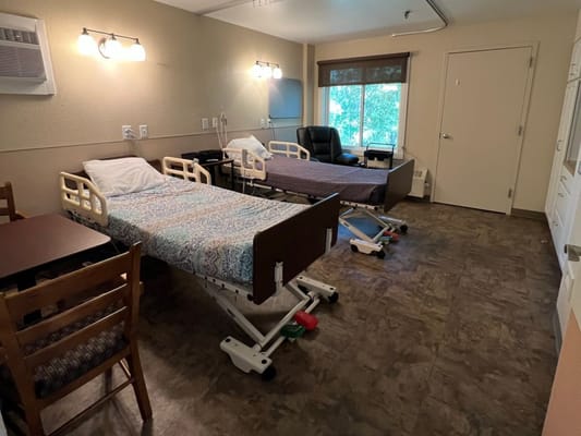 Private resident room with beds and furniture