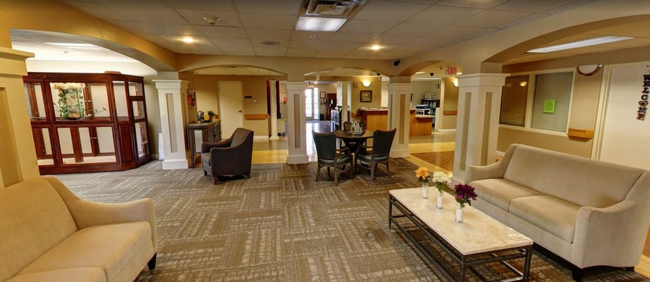Common area seating in a bright facility lobby