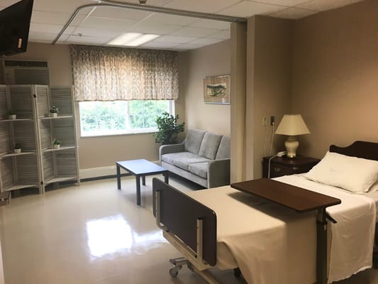 A well-furnished resident room in a nursing facility