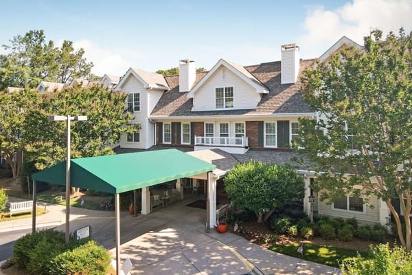 Exterior view of assisted living facility with green awning