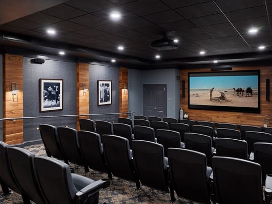 Interior view of a cozy cinema room with seating