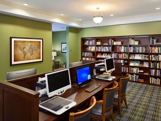 Interior library with computers and bookshelves