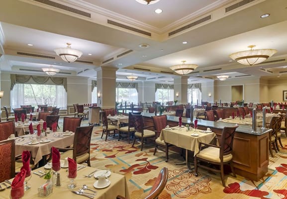 Dining room set up for meal service with elegant decor