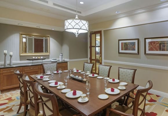 Dining room set up for a meal with elegant decor