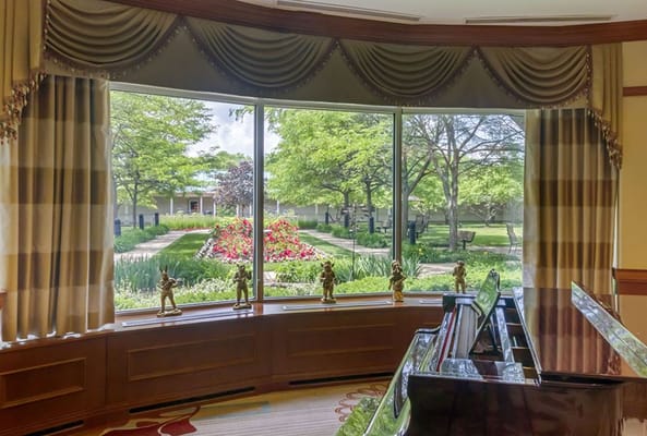 View of a garden from a brightly lit interior