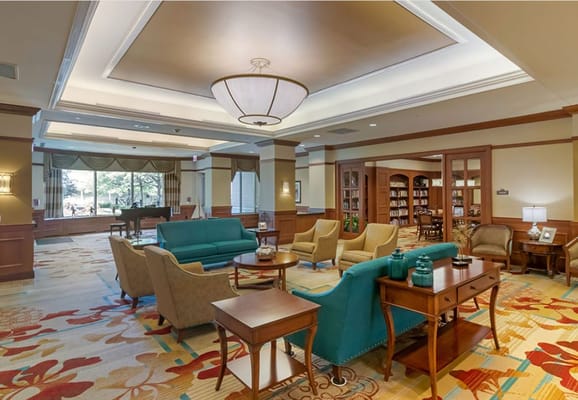 Common area with seating and bookshelves
