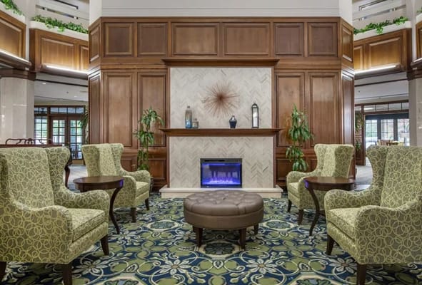 Elegant common area with seating and a fireplace