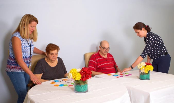 Residents engaging in a group activity with staff