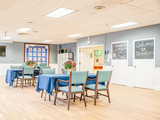 Interior activity room with tables and decorations