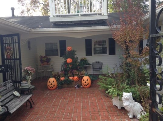 Outdoor area decorated for Halloween with pumpkins