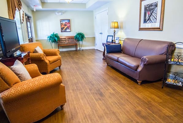 A bright common area with seating and decor