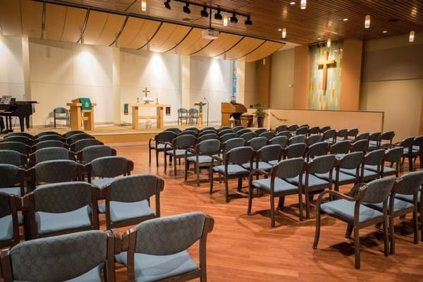 Interior view of a chapel with empty chairs