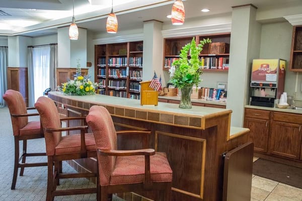 Interior view of a cozy common area with bookshelves