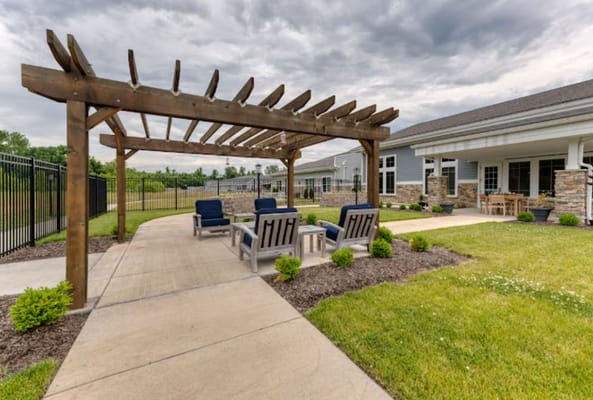 Outdoor seating area with pergola and lounge chairs